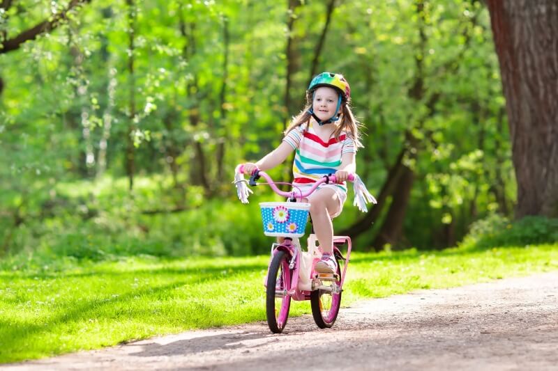 girl learning to ride a bike 