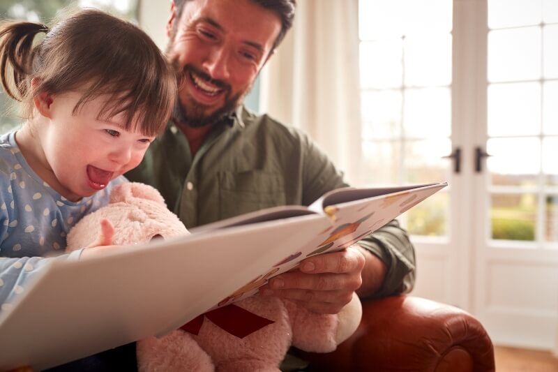 dad reading to daughter