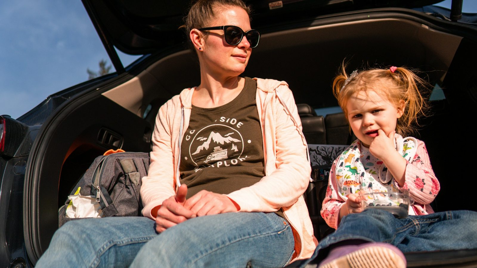 Toddler buckled in a car seat, ready for a family road trip